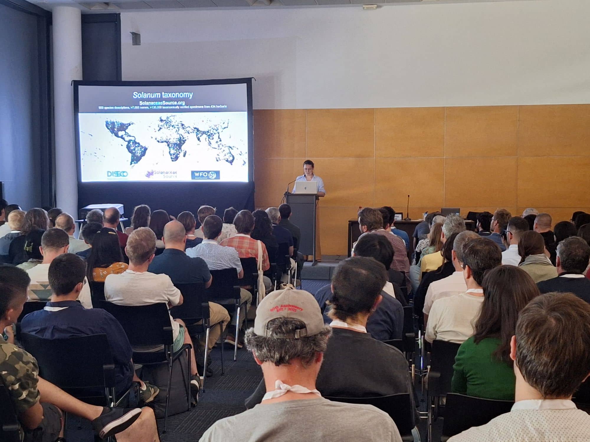 A speaker presenting to an audience